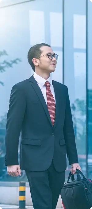 business man carried his laptop front office building